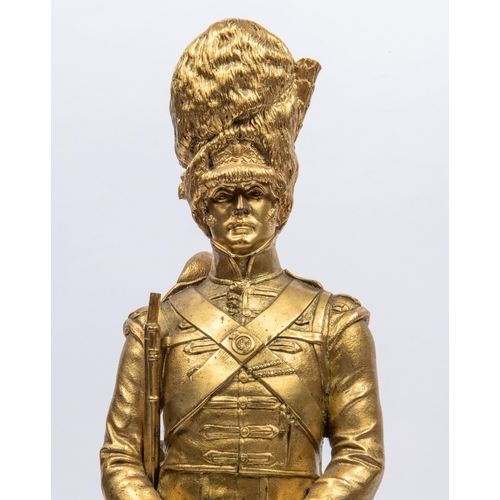 45 - A pair of well executed brass figures of Grenadier Guardsmen, 1815 and 1889, height 17½, signed G E ... 