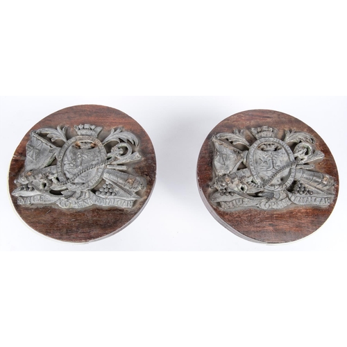 60 - An interesting pair of 19th century naval tompions, the oak plug 5¼