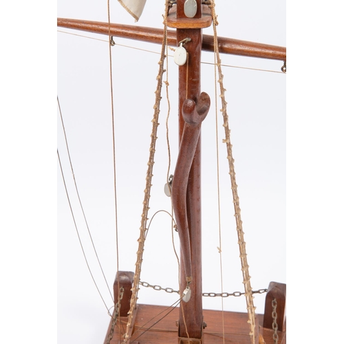 64 - An Imperial German nautical desk ornament in the form of a partly rigged mast flying naval ensign, v... 