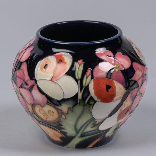 10 - A small Moorcroft pottery vase from 2019. With butterflies and honesty design on purple ground by Em... 