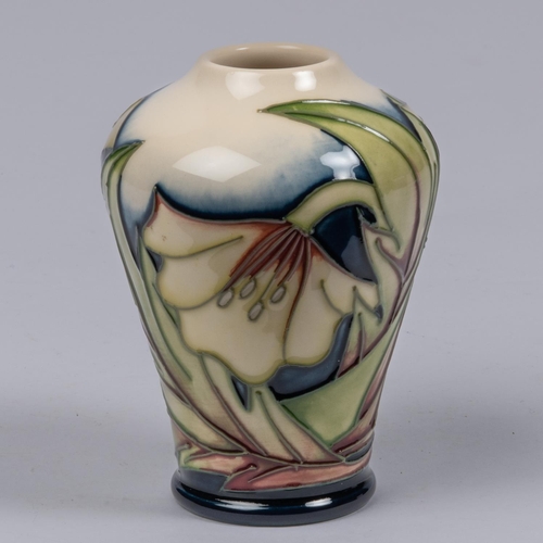 14 - A Moorcroft pottery miniature vase. With stylised floral design. Marks etc to base dated 2005 with p... 