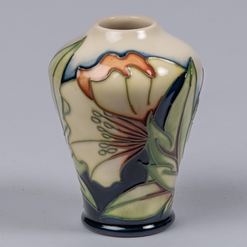 14 - A Moorcroft pottery miniature vase. With stylised floral design. Marks etc to base dated 2005 with p... 