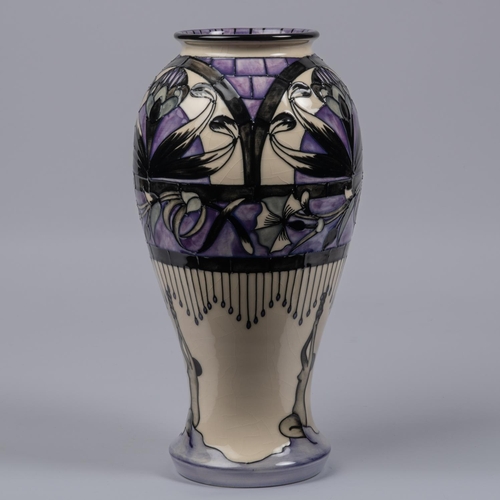 19 - A Moorcroft pottery tall vase. With Art Nouveau design. Impressed marks etc to base, dated 1993 and ... 