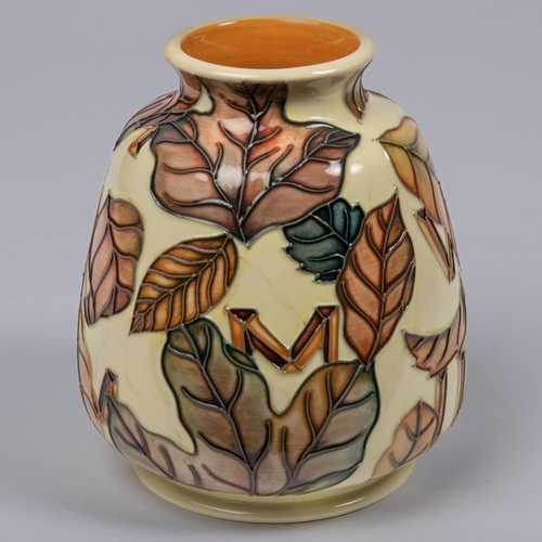 20 - A Moorcroft pottery vase. With autumn leaves and Roman numerals on yellow ground. Marks to base, CES... 