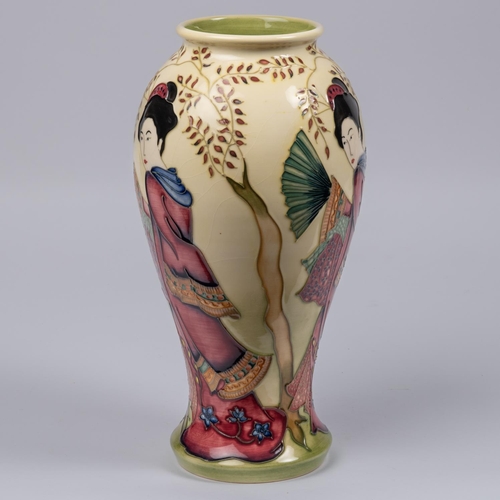 28 - A Moorcroft pottery vase. With Japanese figures on a cream ground. Marks to base, HM, eye date cyphe... 