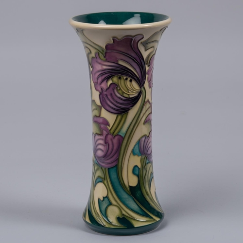 29 - A Moorcroft pottery vase. With liries on cream ground, designed by Kerry Goodwin. Marks to base, HM,... 