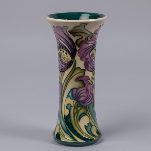 29 - A Moorcroft pottery vase. With liries on cream ground, designed by Kerry Goodwin. Marks to base, HM,... 