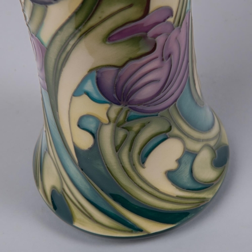 29 - A Moorcroft pottery vase. With liries on cream ground, designed by Kerry Goodwin. Marks to base, HM,... 