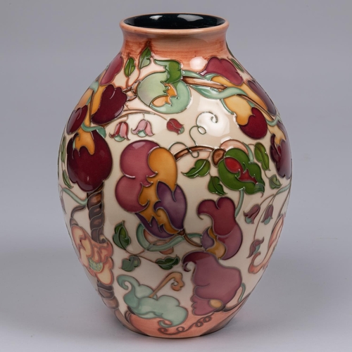 30 - A Moorcroft pottery vase. With a stylised mixed floral design. Marks to base, pineapple date cypher ... 