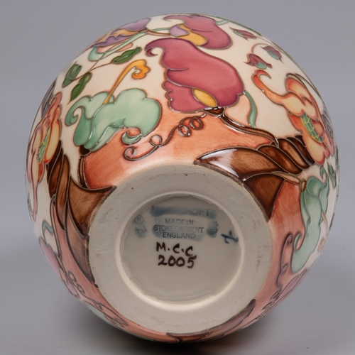 30 - A Moorcroft pottery vase. With a stylised mixed floral design. Marks to base, pineapple date cypher ... 