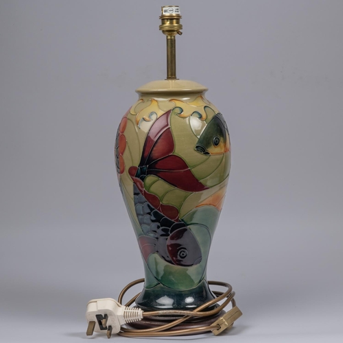 3 - Two Moorcroft pottery lamp vases. One with a Japanese scene and one with a fish design. Overall heig... 