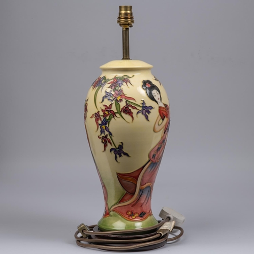 3 - Two Moorcroft pottery lamp vases. One with a Japanese scene and one with a fish design. Overall heig... 