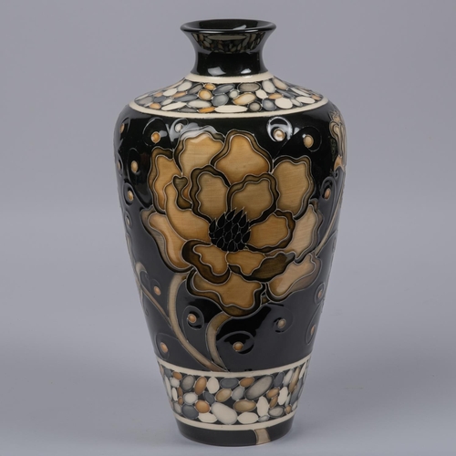 33 - A Moorcroft pottery large vase. Brown flowers on black ground designed by Marie Penkethman. Marks to... 