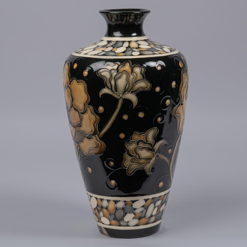 33 - A Moorcroft pottery large vase. Brown flowers on black ground designed by Marie Penkethman. Marks to... 