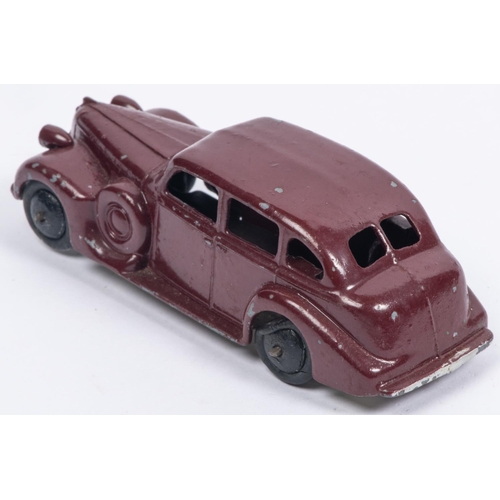 399 - A Dinky Toys 39d Buick Viceroy Saloon in maroon with early metallic laquered baseplate, smooth black... 