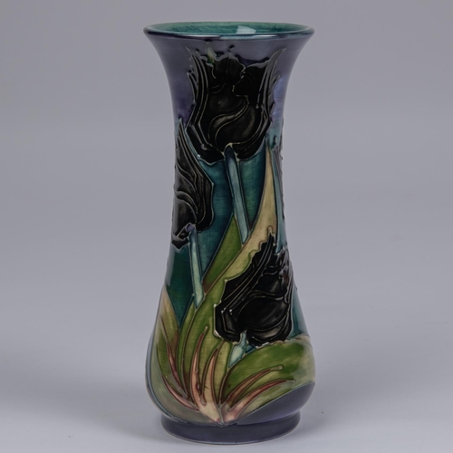 42 - A Moorcroft pottery vase. Black tulips on a sea-green and purple ground. Impressed marks to base, be... 