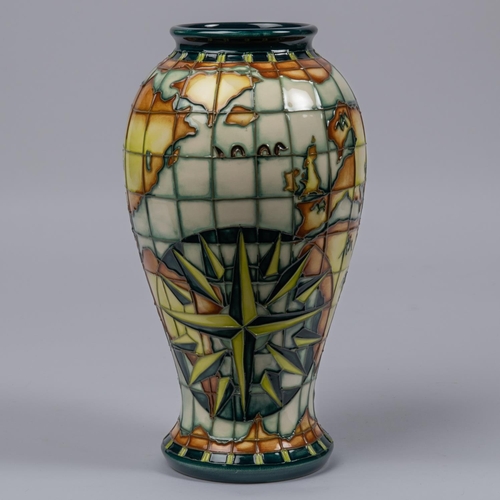 46 - A Moorcroft pottery tall vase. With world map, nautical designs, fantasy creatures, etc. Impressed m... 