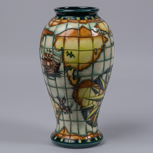 46 - A Moorcroft pottery tall vase. With world map, nautical designs, fantasy creatures, etc. Impressed m... 