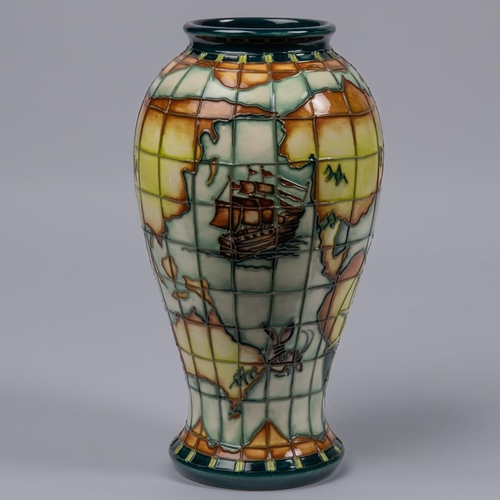 46 - A Moorcroft pottery tall vase. With world map, nautical designs, fantasy creatures, etc. Impressed m... 