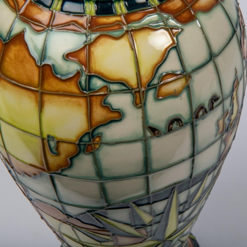 46 - A Moorcroft pottery tall vase. With world map, nautical designs, fantasy creatures, etc. Impressed m... 