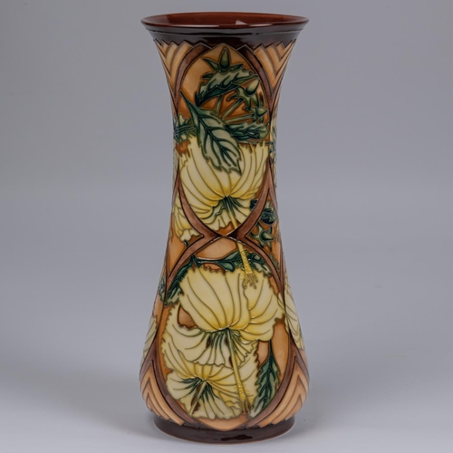 47 - A Moorcroft pottery tall vase. With yellow flowers on brown ground. Impressed marks etc to base, mus... 