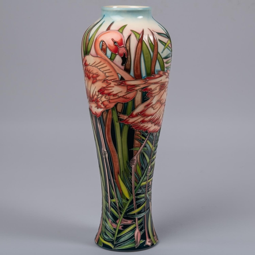 49 - A Moorcroft pottery tall vase. With flamingos in undergrowth. Impressed marks to base, DS, LB, teapo... 