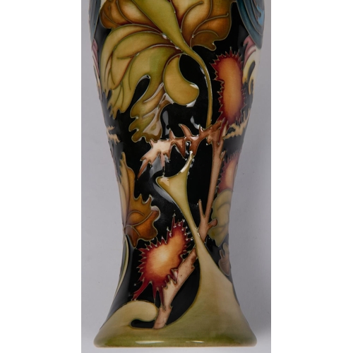 50 - A Moorcroft pottery tall vase. With cockrells on a stylised ground by Kerry Goodwin. Impressed marks... 