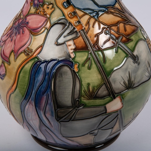 51 - A Moorcroft pottery vase. Arthurian scene showing Sir Bedivere throwing the sword Excalibur into the... 