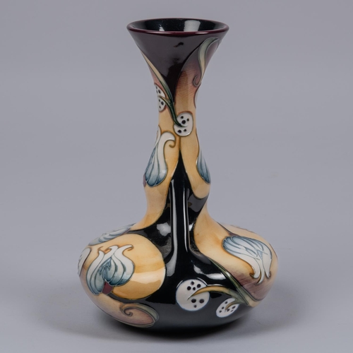 58 - A Moorcroft pottery vase of unusual shape. Stylised flowers design by Sian Leeper. Marks to base, HB... 