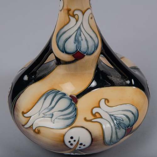 58 - A Moorcroft pottery vase of unusual shape. Stylised flowers design by Sian Leeper. Marks to base, HB... 