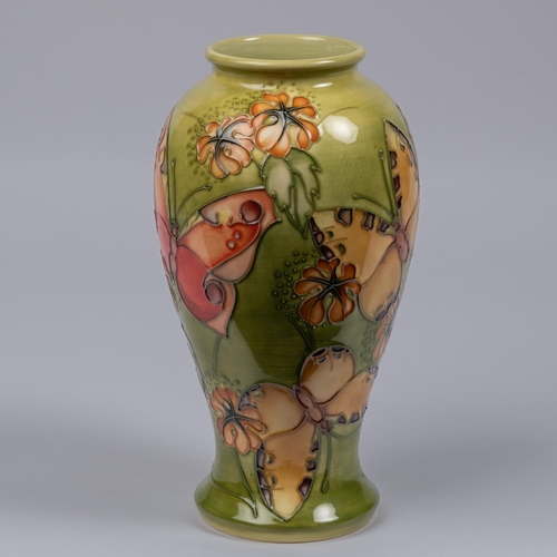 6 - A Moorcroft pottery vase from 1994. A trial piece with butterfly designs. Marks etc to base with eye... 