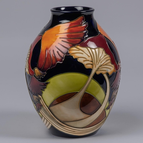 61 - A Moorcroft pottery vase. Stylised mushroooms on a dark blue ground. Marks to base, JS, Q date cyphe... 