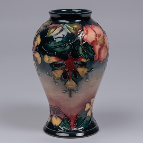 63 - A Moorcroft pottery vase. Trial vase flowers on a graded ground. Marks to base, MP, diamond date cyp... 