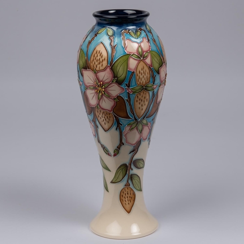 64 - A Moorcroft pottery vase. Pale straberries on a cream and blue ground. Marks to base, pineapple date... 