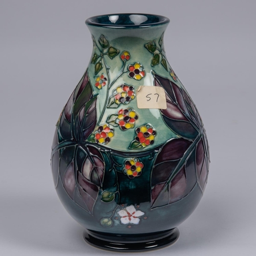 67 - A Moorcroft pottery vase. Brambles with multi-colour berries and purple leaves. Marks to base, bell ... 