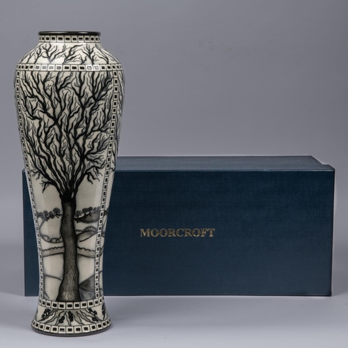 68 - A Moorcroft pottery tall vase. Leafless trees with mushrooms around the bases in black and white by ... 