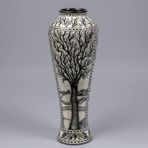 68 - A Moorcroft pottery tall vase. Leafless trees with mushrooms around the bases in black and white by ... 