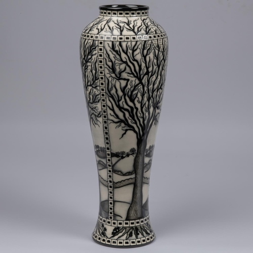 68 - A Moorcroft pottery tall vase. Leafless trees with mushrooms around the bases in black and white by ... 