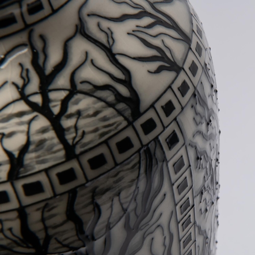 68 - A Moorcroft pottery tall vase. Leafless trees with mushrooms around the bases in black and white by ... 