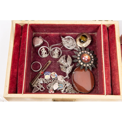 74 - A small box of costume jewellery. Including brooches, bangles, ring, locket, amber necklace, etc. So... 