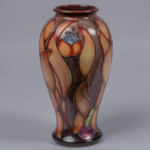 53 - A Moorcroft pottery vase. Leaf shapes in shades of brown on a graded ground. Marks to base, SP, flag... 