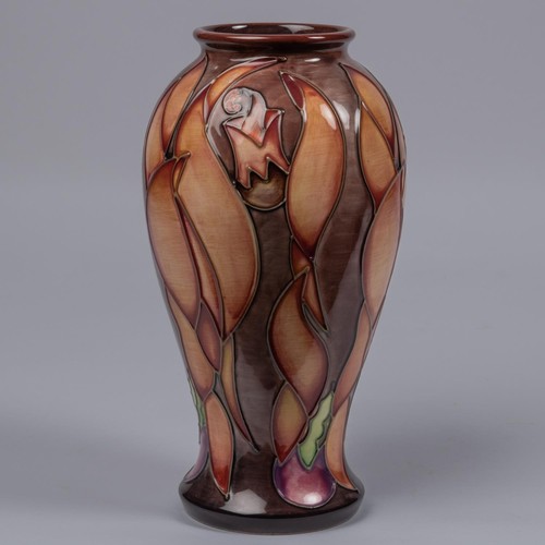 53 - A Moorcroft pottery vase. Leaf shapes in shades of brown on a graded ground. Marks to base, SP, flag... 