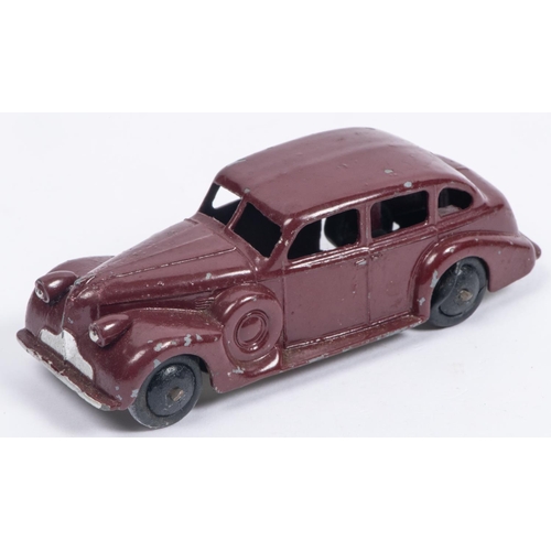 306 - A Dinky Toys 39d Buick Viceroy Saloon in maroon with early metallic laquered baseplate, smooth black... 