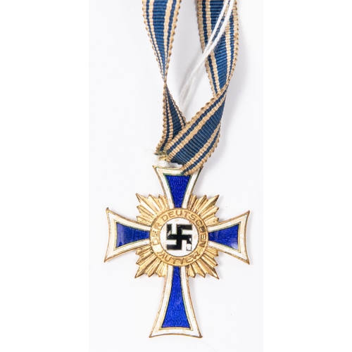 101 - A Third Reich Mother's Cross in gold, in its original box, the lid lining marked 