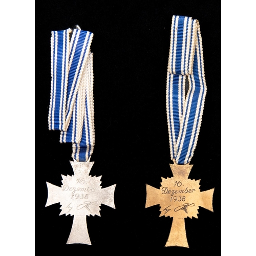 102 - A Third Reich Mother's Cross 2nd class, in silver, and another , 3rd Class in bronze, both with full... 