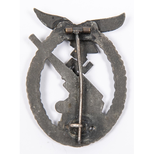 112 - A Third Reich Luftwaffe Flak Gunners' badge, of grey metal with flat back and round pin with wide hi... 