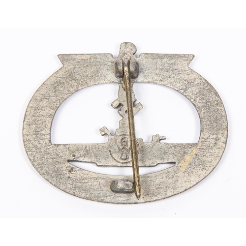 122 - A Third Reich U boat War badge, with fretted out swastika, integral pin fittings, and 