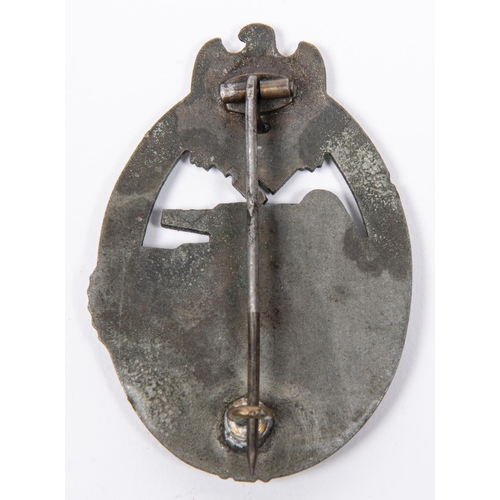 127 - A Third Reich Panzer Assault badge, of grey metal with slightly concave back, partly fretted out swa... 