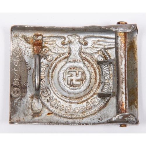 143 - A Third Reich SS man's silver painted steel buckle, the reverse stamped with RZM mark and 