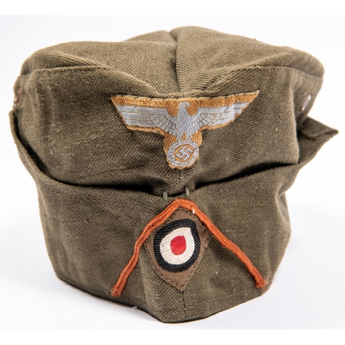 159 - A Third Reich DAK Mans FS cap, olive green  denim with embroidered insignia, dated 1943, GC £400-450